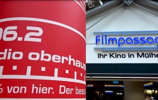 Foto der Filmpassage in Mülheim und im Vordergrund eine Leuchtsäule von Radio Oberhausen.